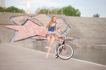 Eugena - redhead teen posing with her bicycle-m22i0045kz.jpg